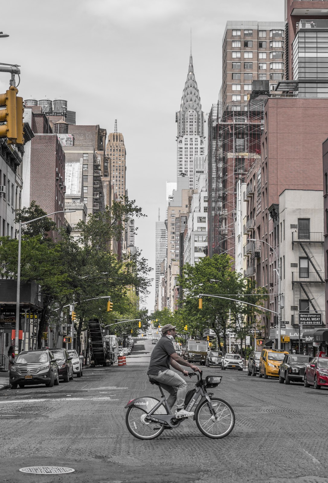 A cyclist crossing the street.
