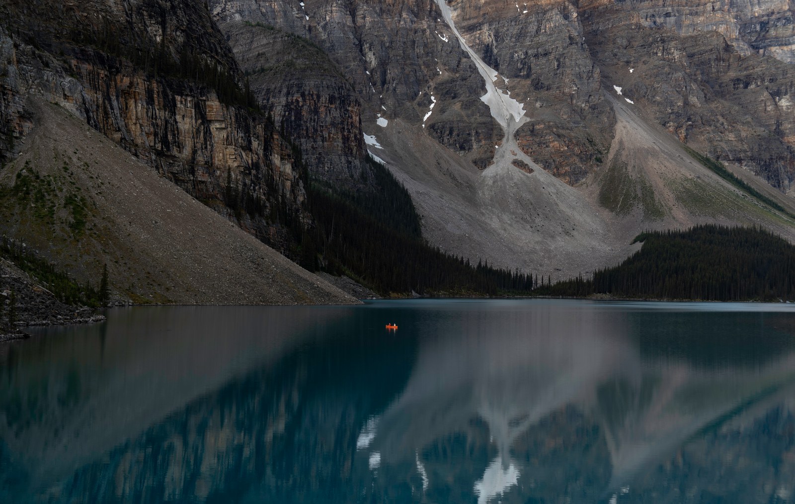 A mountain reflected in a still lake.
