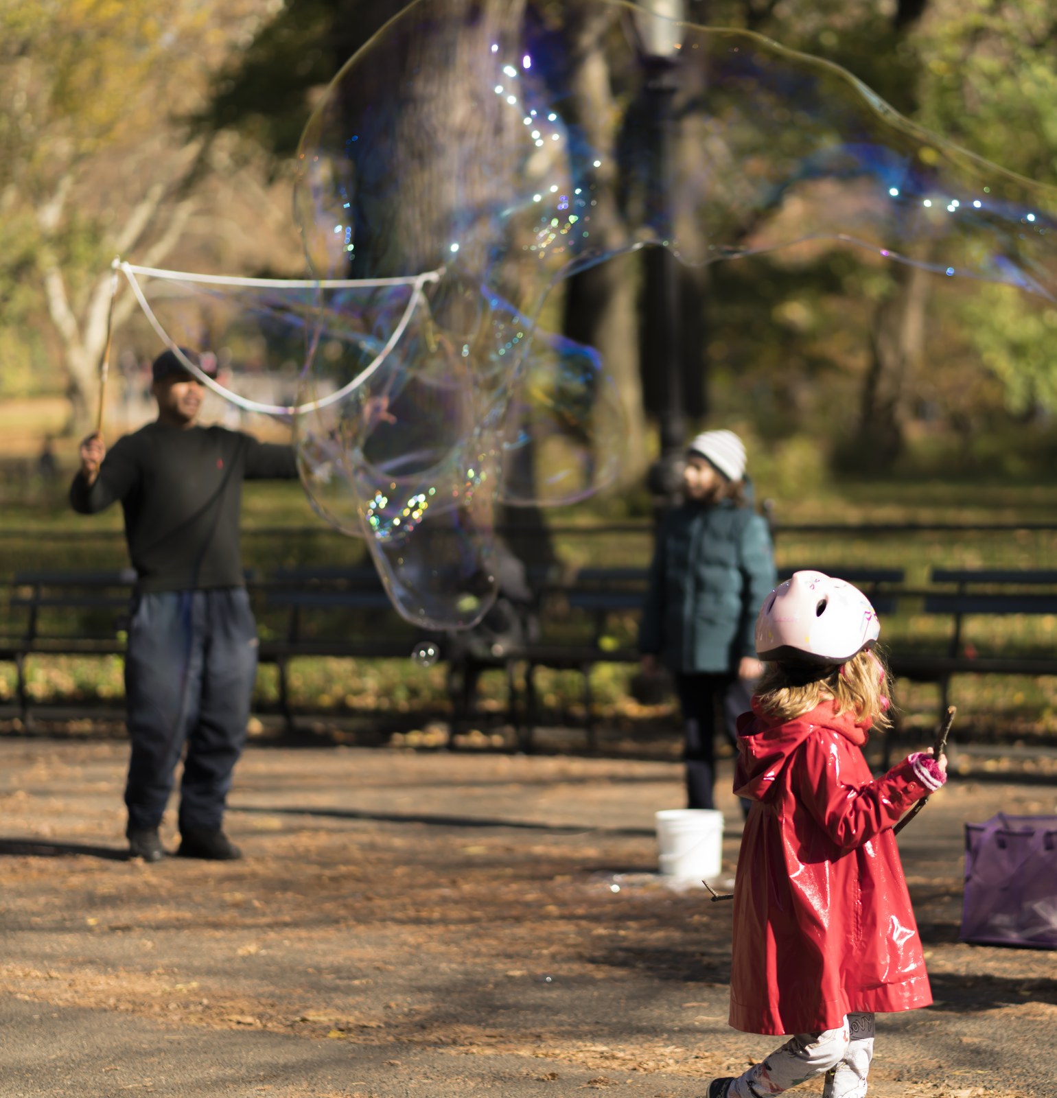 Someone making soap bubbles.